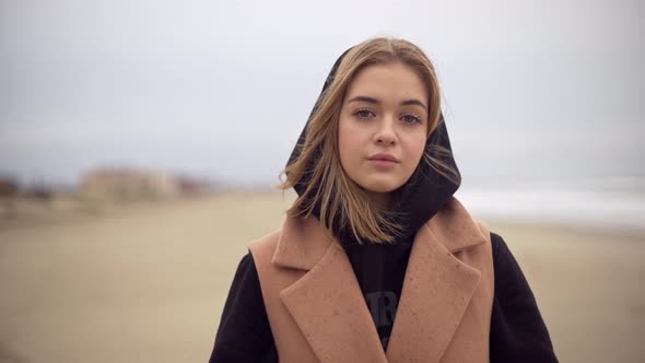 Portrait of Attractive Caucasian Woman Dressed Warmly Having Cold Meaningful Look While Being alt