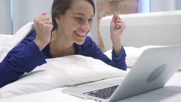 Hispanic Woman reacting to Success alt