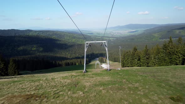 Flying Between the Cable Cars on the Slopes in the Spring