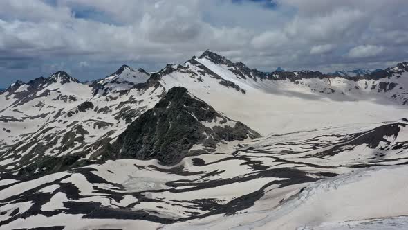 Aerial View of Snow Caucasus Mountains alt