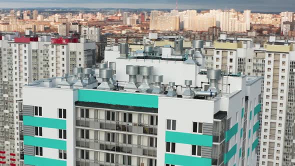 Aerial View of a Residential Building Against the Backdrop of an Urban Landscape alt