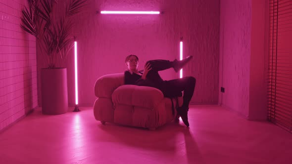 Guy Dancing in Armchair alt