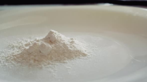 Pour the Flour on a White Plate