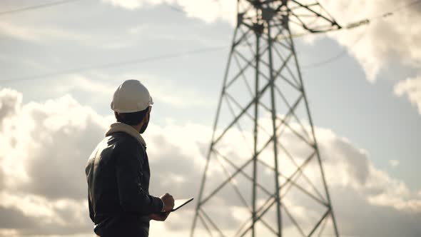 Electrical Engineer Check High Voltage Pole. Power Generation Energy Infrastructure. alt