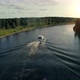 A Motor Boat Floats on the River To the Sunset - VideoHive Item for Sale