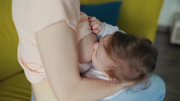 Close Up of Little Newborn Baby While Sucking Mothers Breast Milk, Stock Footage 