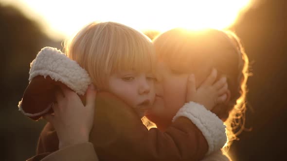 Mom Hugs Her Baby Girl Gently