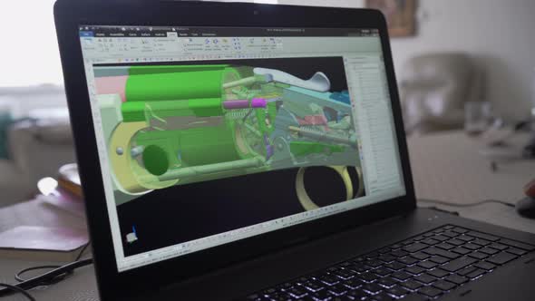 3d graphic designer is working on a rifle concept with a hi-tec mouse. alt
