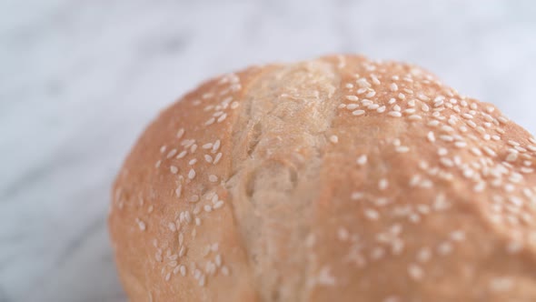 Camera follows sliced white bread. Slow Motion. alt