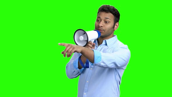 Cheerful Young Man with Megaphone on Green Screen alt