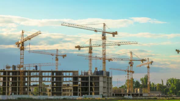 Time Lapse Footage of a Big Construction Site with Several Working Cranes alt