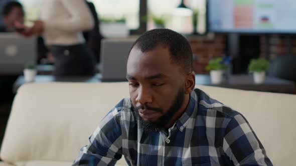 Portrait of African American Person Smiling in Office alt