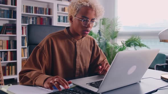 Accountant Preparing Annual Financial Report Checking Result on Calculator alt