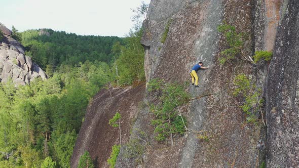 Free Solo Climbing on a Rock Wall in the Siberian Nature Reserve Stolby