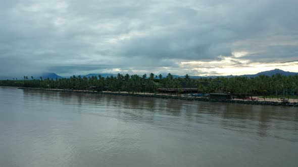 The beautiful, popular beaches of mainland Fiji during sunrise - aerial alt