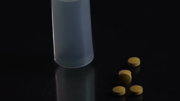 Pill Bottle Falling on Black Surface, Patient Dropping Ineffective Medicine alt