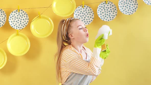 Pleasant Cute Woman in Gray Apron Having Fun with Foam alt