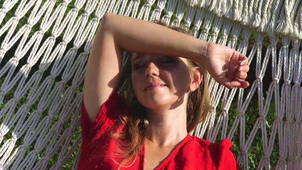 Relaxed Young Woman Enjoy Sun with Closed Eyes Sunbathing Dream of Good Future alt