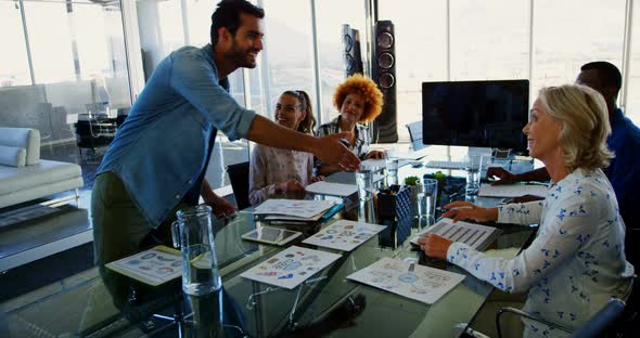 Executives having discussion in the meeting at office alt