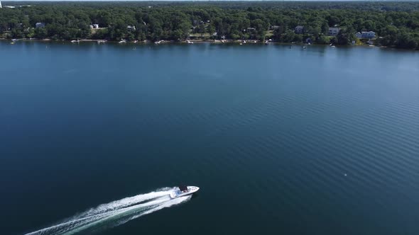 Flying over a boat on a pond alt