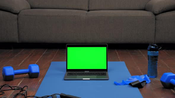 Laptop Display Green Screen Stand on Fitness or Yoga Mat on Home Sofa Background alt
