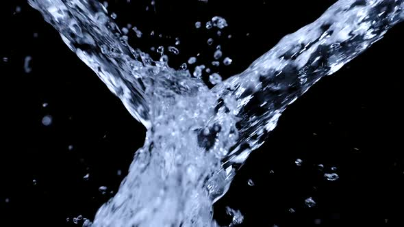 Slow Motion of Flying Drinking Water Splashes Isolated on Black Backdrop