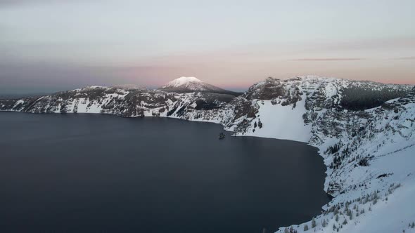 Drone view of Crater Lake and Mazama volcano, glacier and caldera lake in Oregon alt