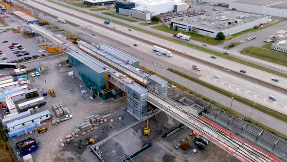 4K camera drone view of the construction site of the new Fairview Station of the REM in Montreal.