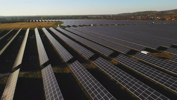 Drone Flight Over Rows of Solar Panels alt