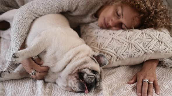 Woman sleep with dog at home