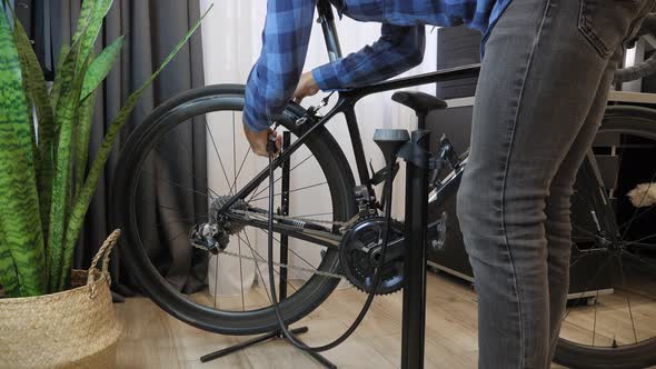 Pumping up bicycle wheel alt