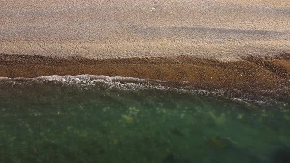 Aerial View From Above on Azure Sea and Pebbles Beach alt
