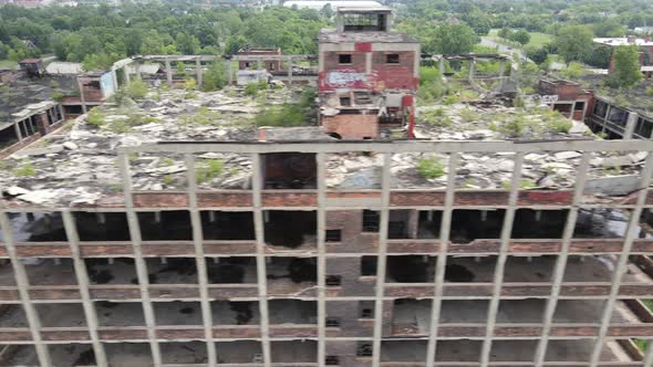 Abandoned Packard Automotive Plant in Detroit, Michigan drone video sweeping shot. alt