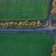 A Blue Car is Driving Along a Road Between Green Fields - VideoHive Item for Sale