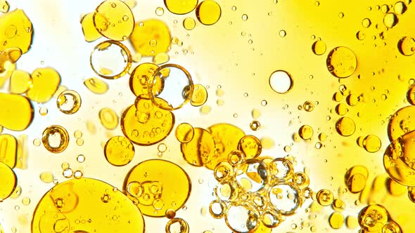 Super Slow Motion Shot of Moving Oil Bubbles Isolated on White Background at 1000Fps alt