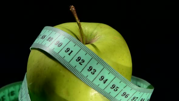 Green, Fresh Apple with Measuring Tape on White, Rotation, Reflection alt