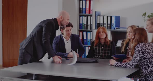 Aggressive Manager in Meeting at Office alt