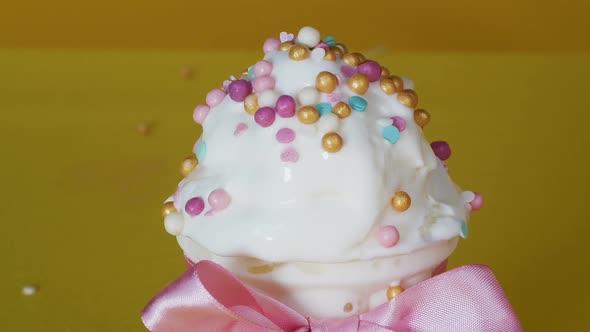 Close-up of Ice Cream Sprinkled with Balls, Dessert Decoration. Yummy Ice-cream.