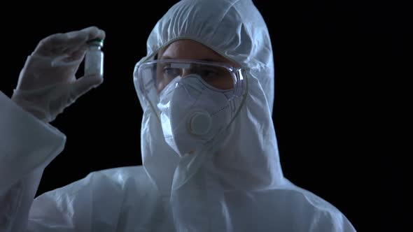 Laboratory Worker Showing Bottle With White Powder, Illegal Drug Production alt