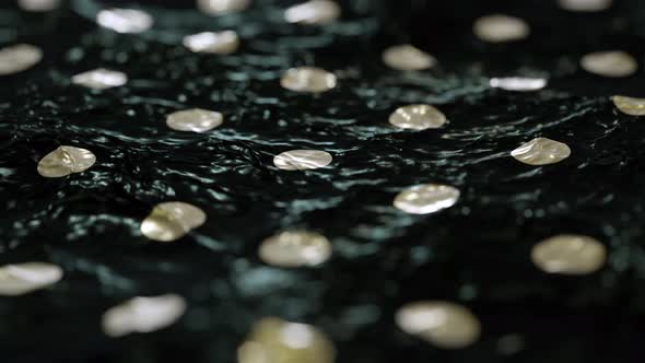 Abstract Dark Liquid Surface with Golden Pokladots