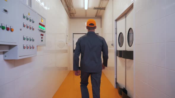 a Man Walks Into a Production Workshop