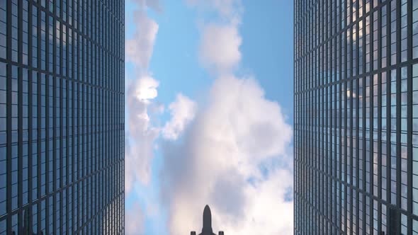 Airplane flies to the tops of the skyscrapers. Look up view at skyscrapers and flying plane alt