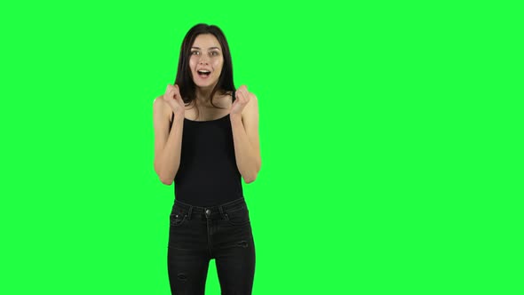 Young Surprised Girl with Shocked Wow Face Expression. Green Screen alt