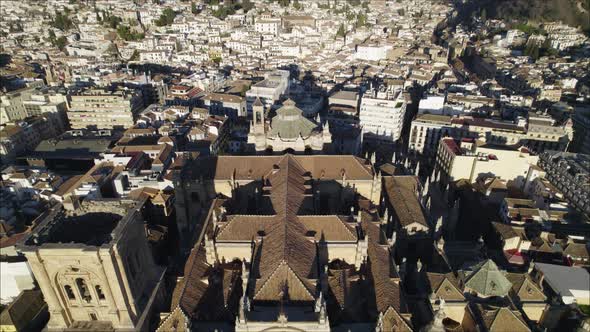Stately Granada Cathedral surrounded by densely built city; aerial