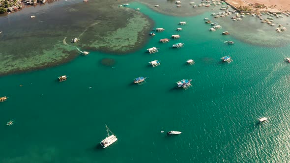 Tourist Boats in a Bay with Blue Water alt