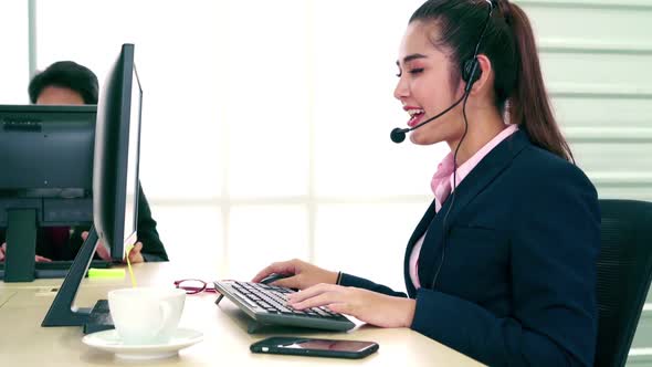 Business People Wearing Headset Working in Office alt