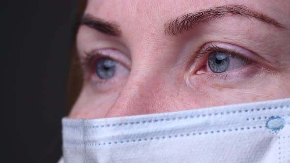 Masked Girl. Coarse Eyes and Mask. Covid-19 Epidemic and Pneumonia Pandemic in China. Protection alt