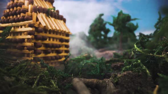 Miniature Scene with Toy House Shrouded in Smoke in Summer alt