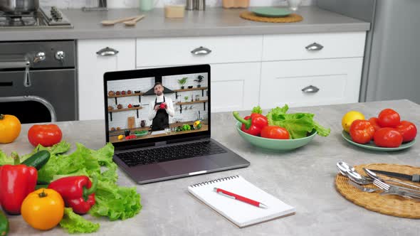Laptop Computer with Man Chef Food Blogger in Screen Tells Teaches Students alt