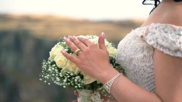 Bride With A Bouquet In Nature